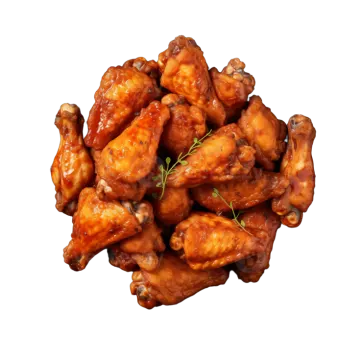 a black plate with chicken wings on it