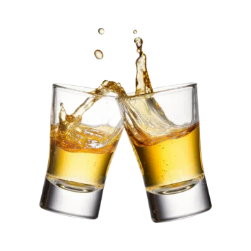two glasses of whiskey with splash