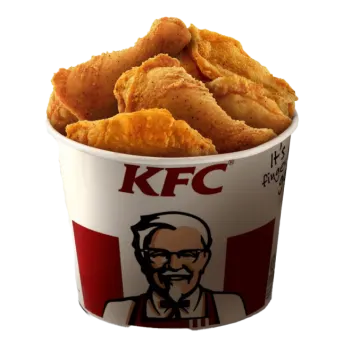 a cup filled with chicken nus on a white background