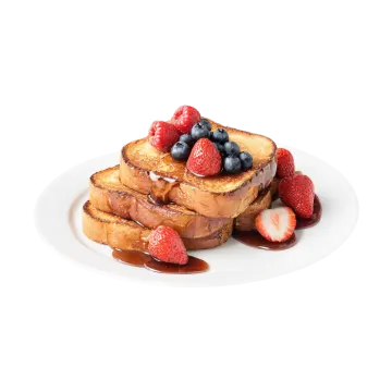 a white plate topped with french toast and berries