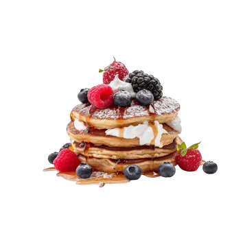 a stack of pancakes with berries and whipped cream