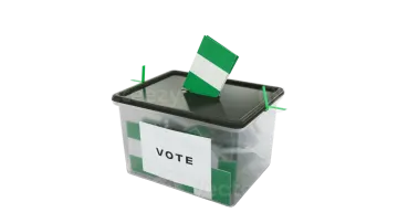 a ballot box with voting paper in it