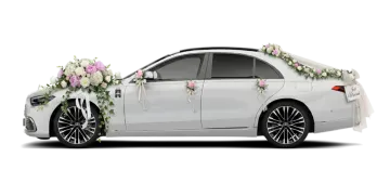 a white car with flowers on the side
