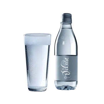 a bottle of water next to a glass