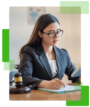 a woman in a business suit sitting at a desk