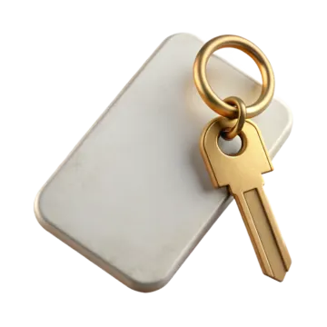 a gold key on top of a white phone