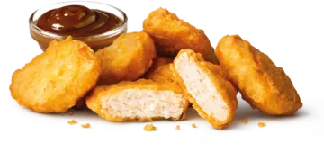 a pile of fried chicken nus with dipping