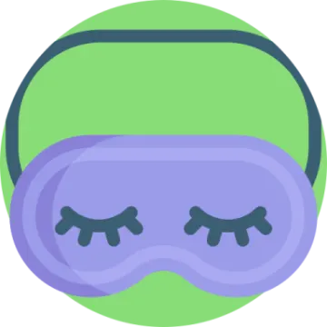 a purple and green mask with eyes closed
