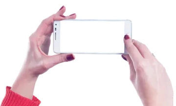 a woman holding up her phone to take a picture
