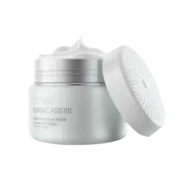 a white jar with a lid on it and the lid open