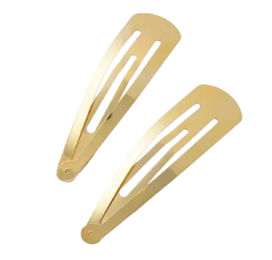 a pair of gold hair clips