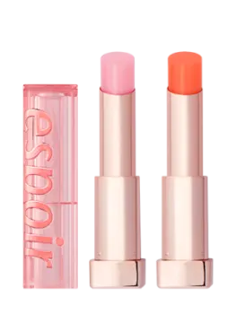 a close up of two lipsticks on a white background