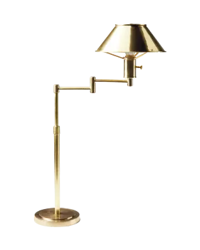 a brass table lamp on a white background