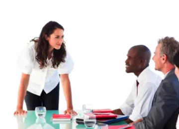 a group of people sitting around a conference table