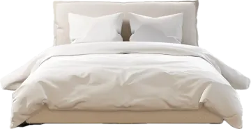 a bed with white sheets and pillows