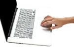 a person is typing on a laptop
