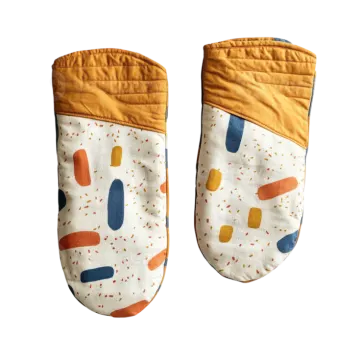 a pair of baby shoes with colorful spots on them