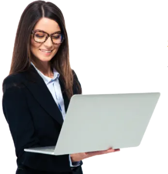 a woman in a business suit holding a laptop