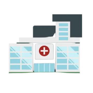 a hospital building with a cross on the front