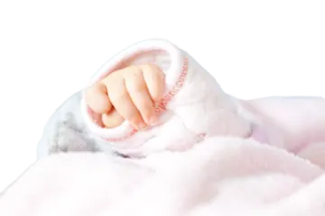 a baby is wrapped up in a blanket