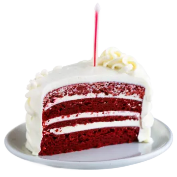 a slice of red velvet cake with white frosting
