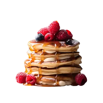 a stack of pancakes with syrup and berries