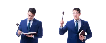a man in a suit and tie holding a book
