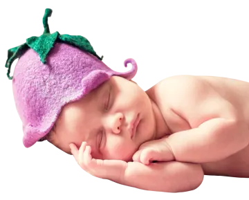 a baby sleeping in a purple hat
