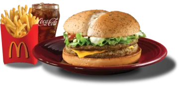 a red plate with a hamburger and fries on it