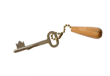 a metal key with a wooden handle on it