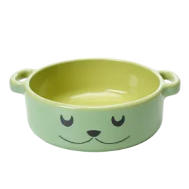a green bowl with a smiling face on it