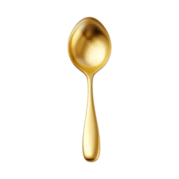 a golden spoon with a drop of liquid