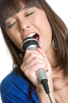 a woman singing into a microphone on a white background