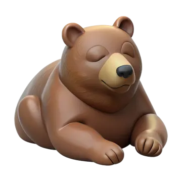 a brown bear laying down on the ground