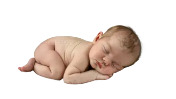 a baby sleeping on a white background