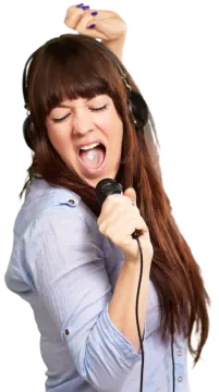 a woman with headphones singing into a microphone