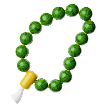 a bracelet with green marble beads and a yellow bea