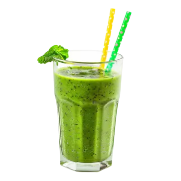 a green smoothie in a glass with a straw
