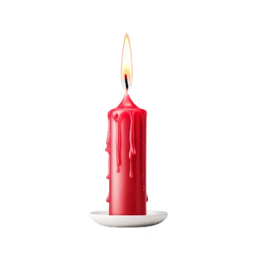 a red candle sitting on top of a plate