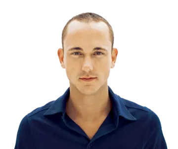 a man in a blue shirt is looking at the camera