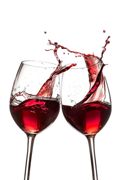 two wine glasses with red wine splashing out