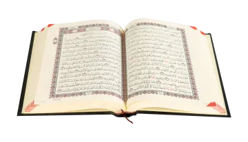an open quran on a white background
