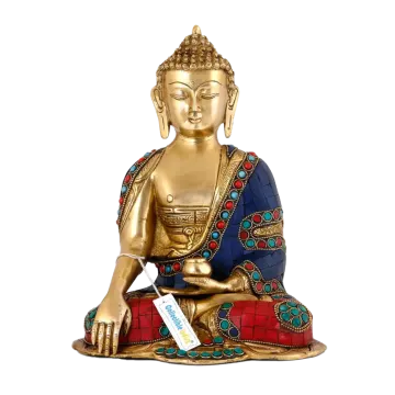 a gold buddha statue with blue and red accents