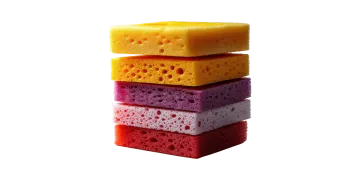 a stack of three different colored sponges