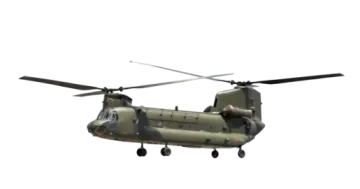 a military helicopter flying through the air