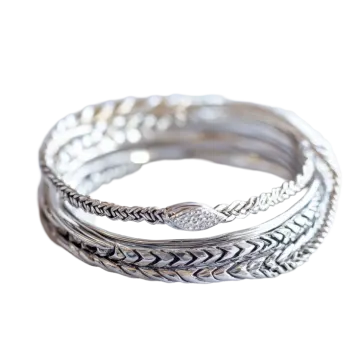 a stack of silver rings on a white background
