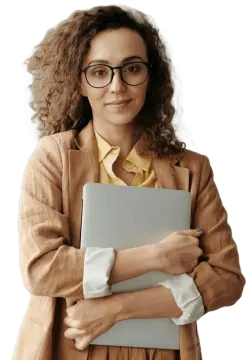 a woman wearing glasses and holding a laptop