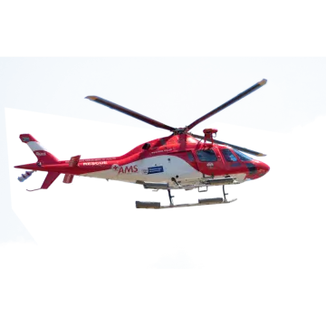 a red and white helicopter flying in the sky