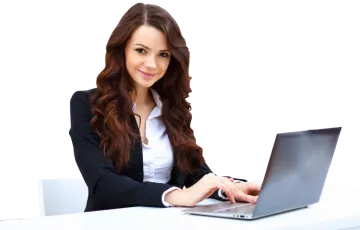 a woman sitting at a desk with a laptop