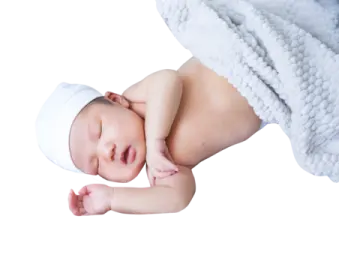 a baby laying on top of a blanket